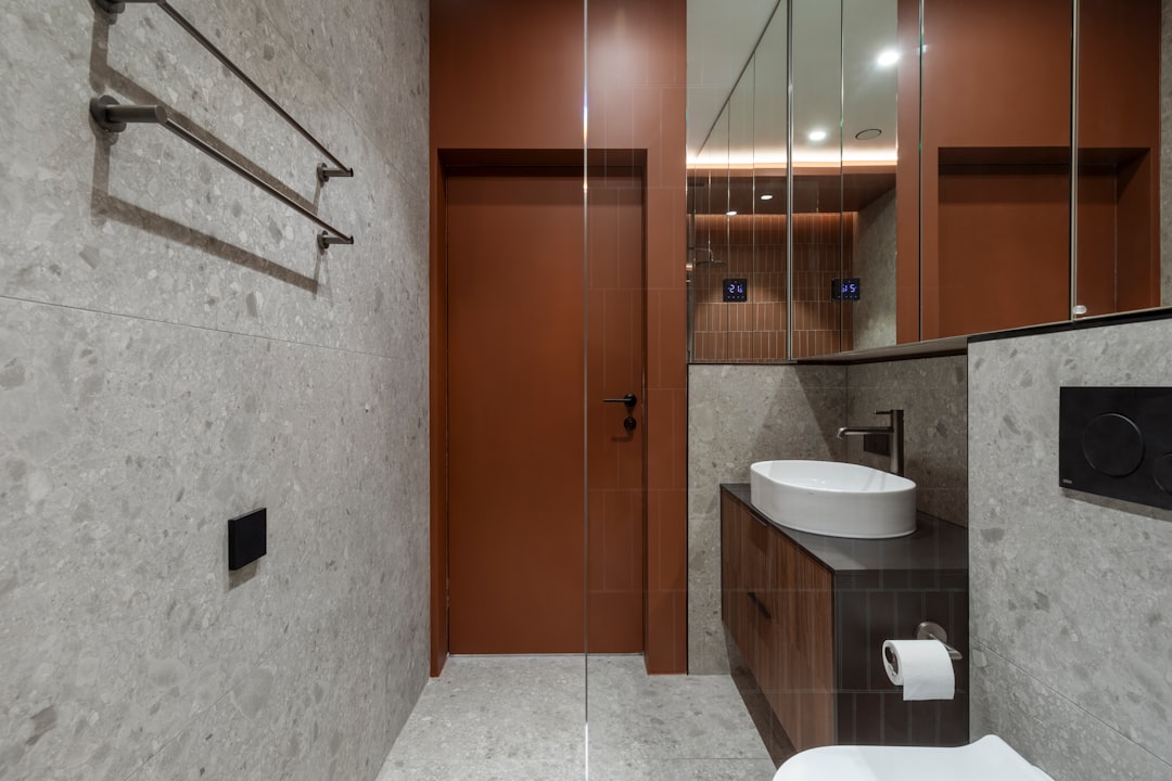 Small bathroom vanity with layered mirror and lighting