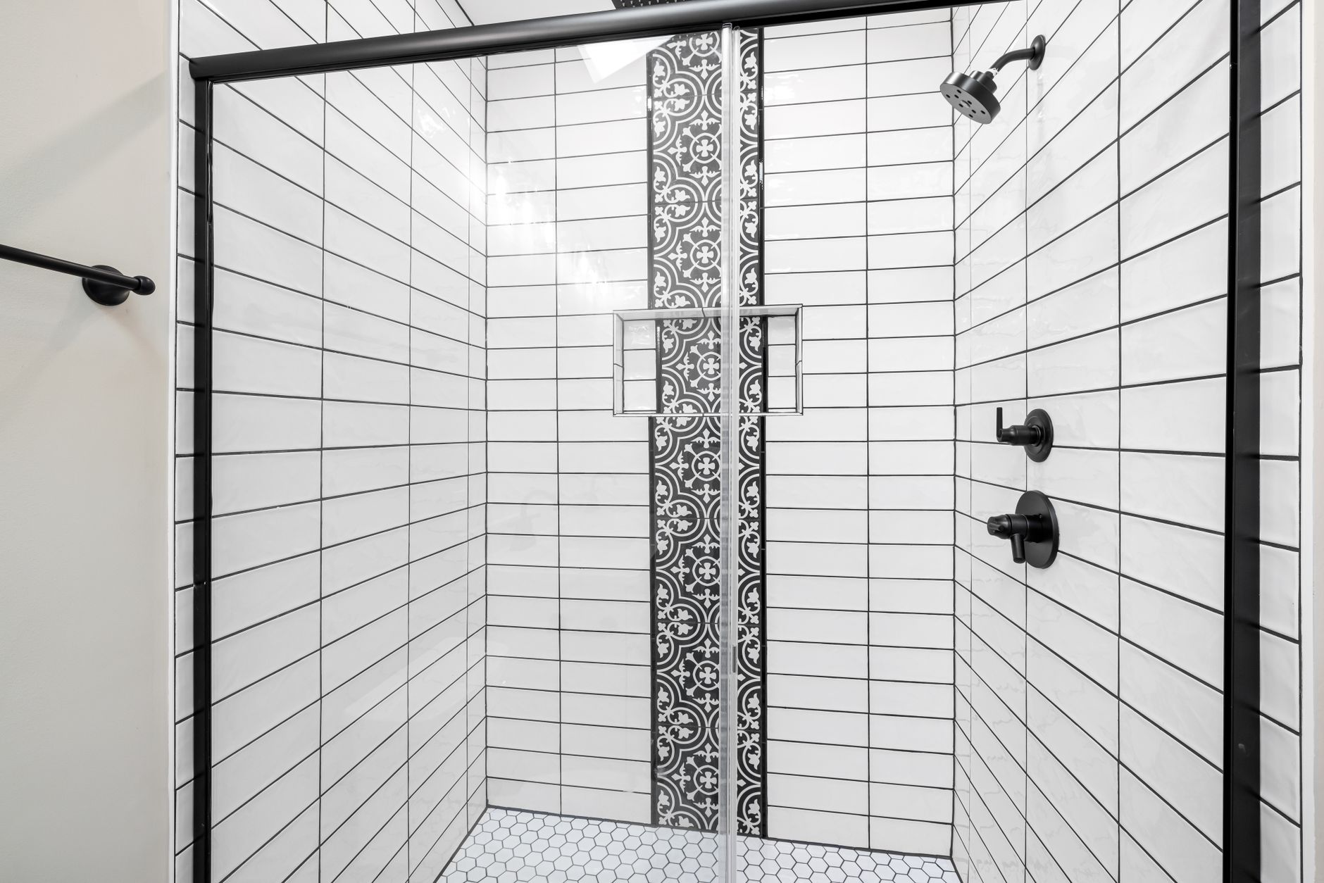Modern remodeled bathroom with new tile shower and vanity
