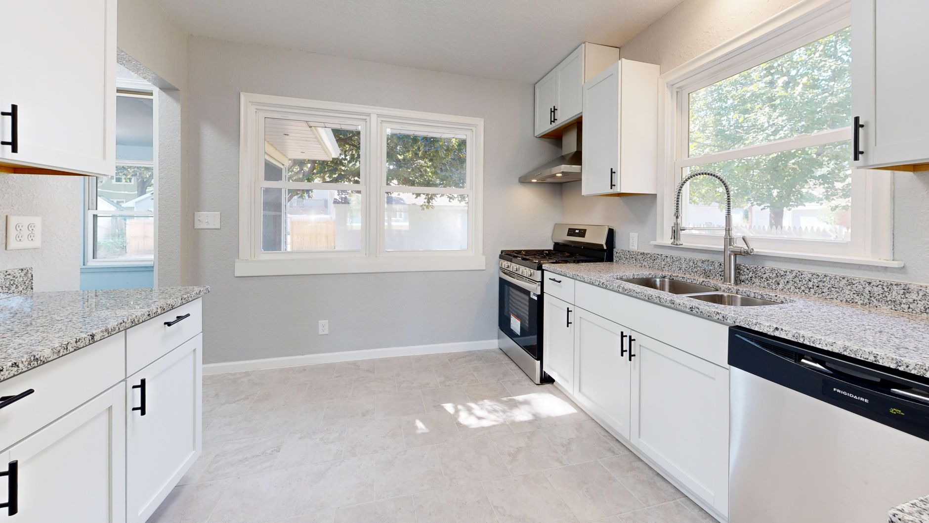 Modern remodeled kitchen with new cabinetry and countertops